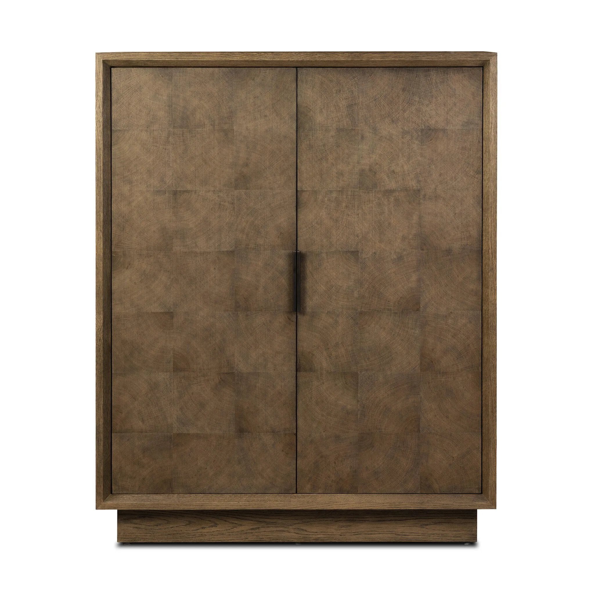 Grounding and stunning. We paired a modern frame and chunky base with door panels featuring oyster cuts of oak that take a specialized skill to create. Each cut captures the story of the wood and brings a natural, organic rhythm to the entire cabinet, and any space. Amethyst Home provides interior design, new home construction design consulting, vintage area rugs, and lighting in the Salt Lake City metro area.