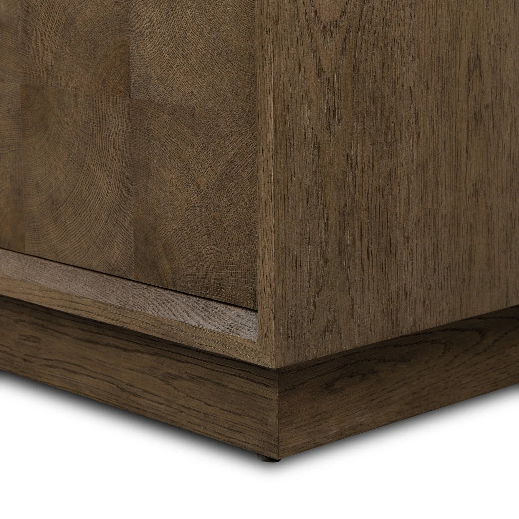 Grounding and stunning. We paired a modern frame and chunky base with door panels featuring oyster cuts of oak that take a specialized skill to create. Each cut captures the story of the wood and brings a natural, organic rhythm to the entire cabinet, and any space. Amethyst Home provides interior design, new home construction design consulting, vintage area rugs, and lighting in the Tampa metro area.