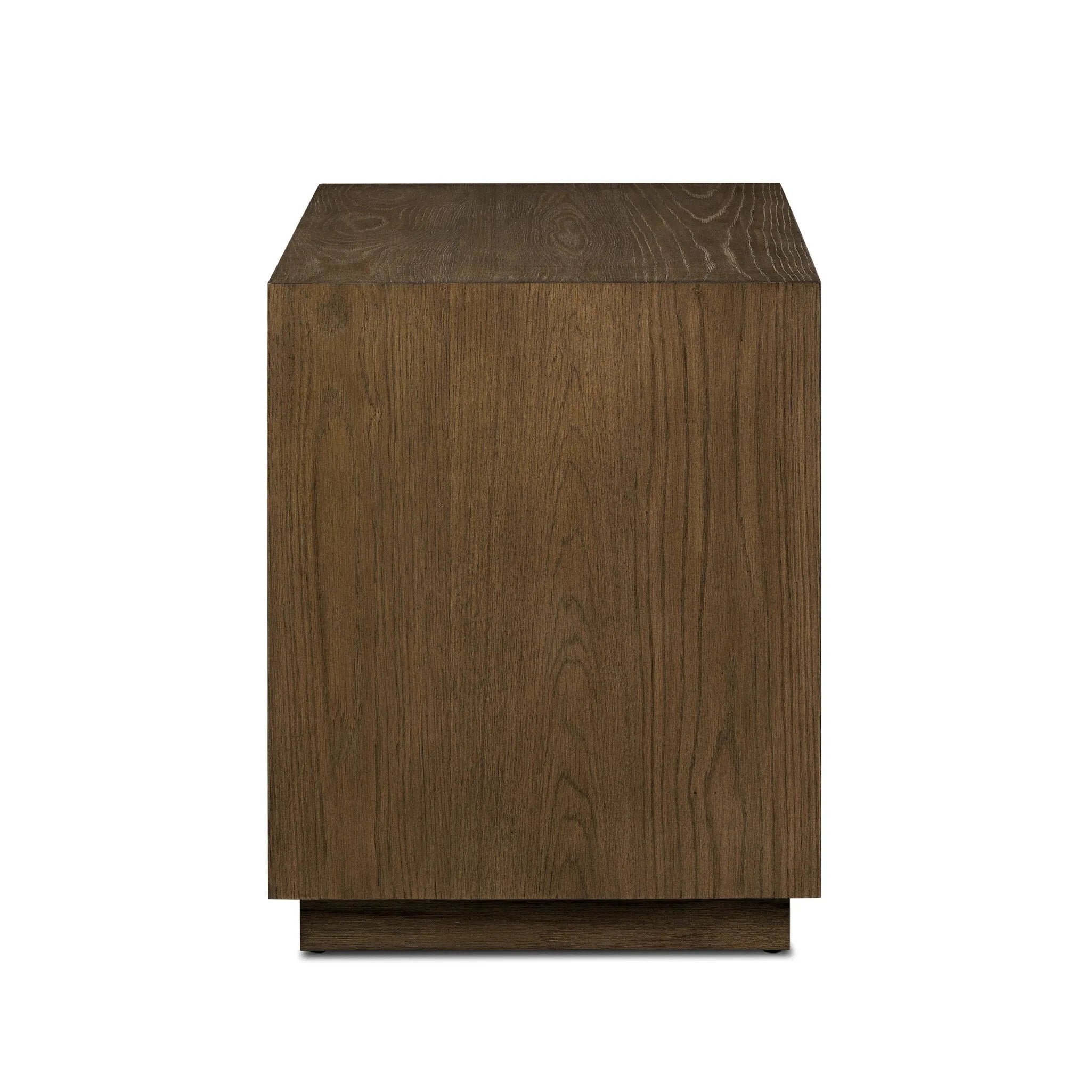 Influenced by contemporary design, this nightstand’s simple frame showcases thick brown oak veneer with a tiled oyster cut pattern on the insert panels. Three drawers with minimalist metal pulls offer ample space for bedside essentials. Amethyst Home provides interior design, new home construction design consulting, vintage area rugs, and lighting in the Boston metro area.