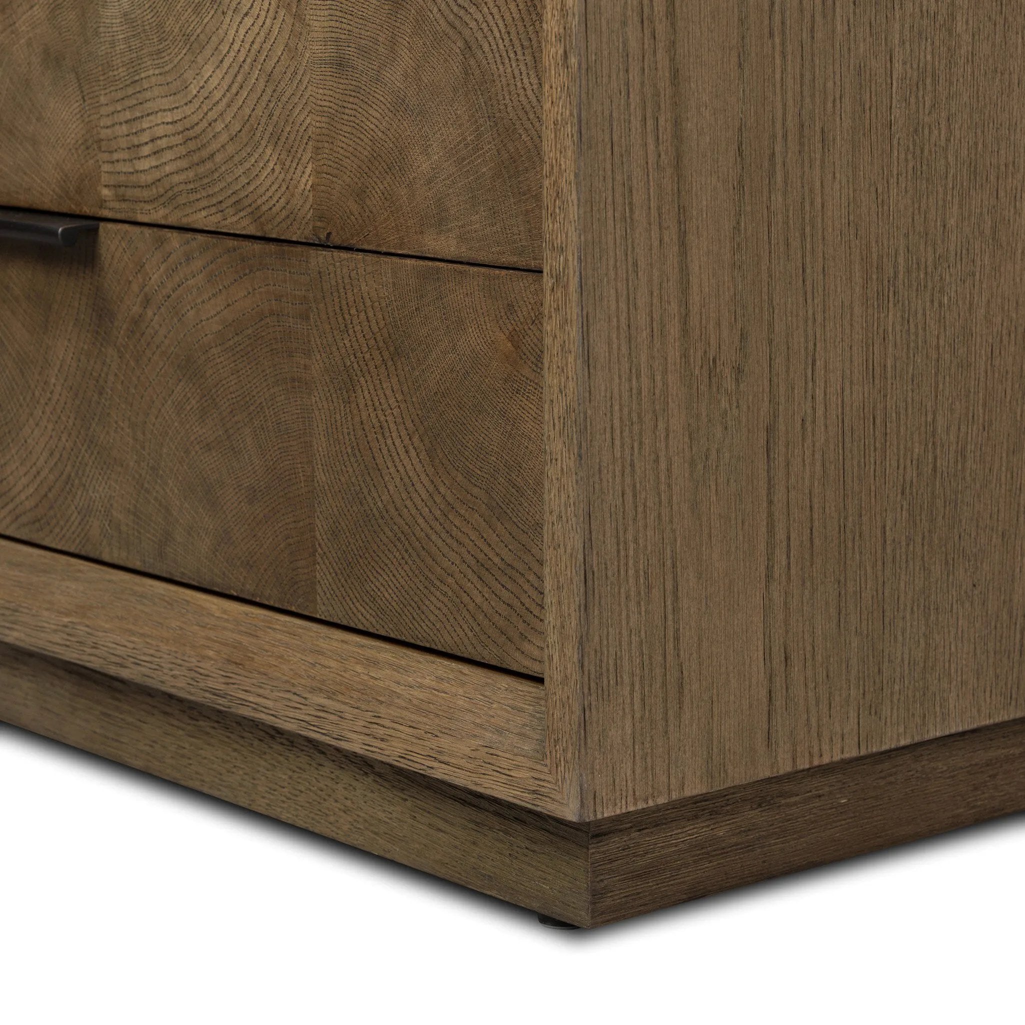 Influenced by contemporary design, this nightstand’s simple frame showcases thick brown oak veneer with a tiled oyster cut pattern on the insert panels. Three drawers with minimalist metal pulls offer ample space for bedside essentials. Amethyst Home provides interior design, new home construction design consulting, vintage area rugs, and lighting in the Houston metro area.