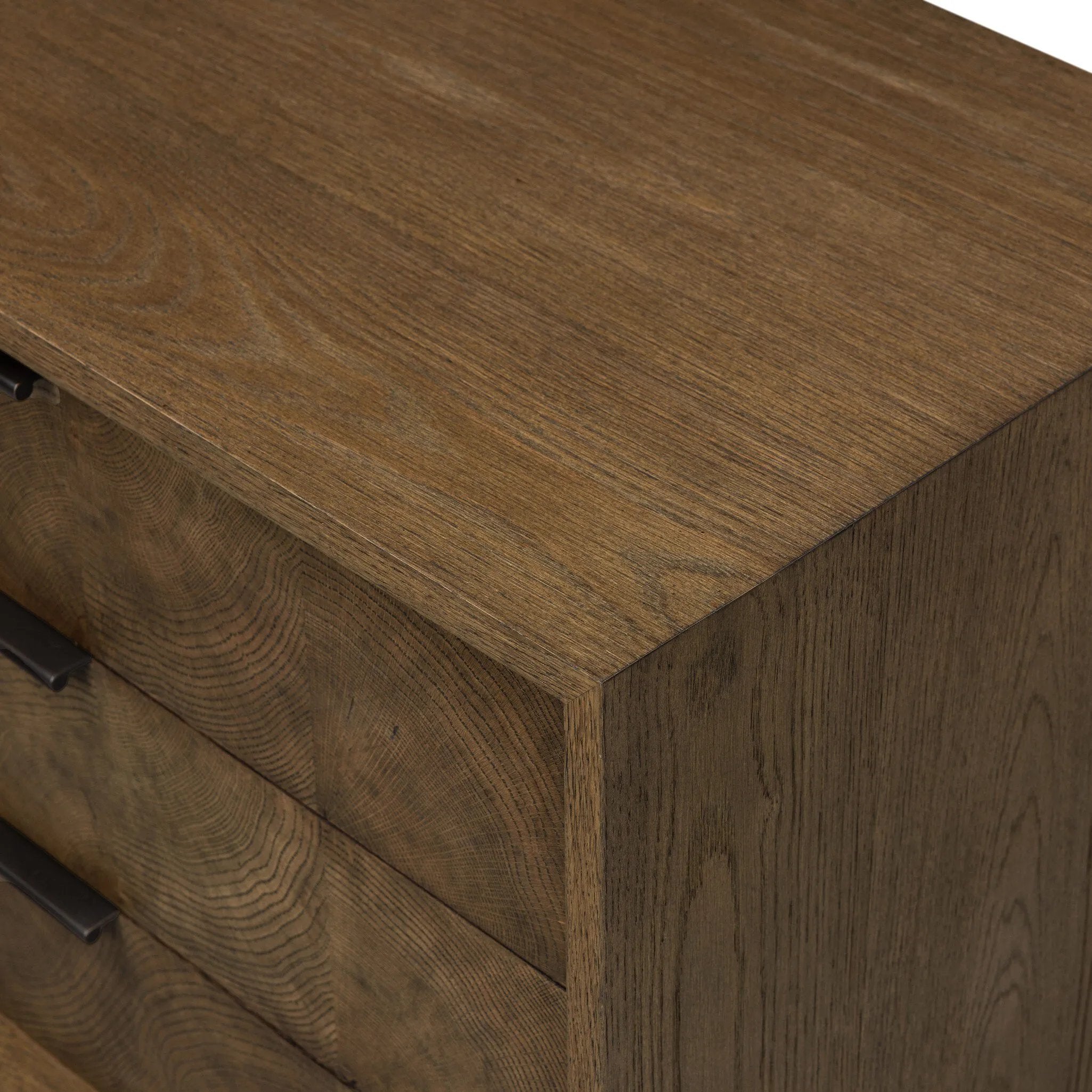 Influenced by contemporary design, this nightstand’s simple frame showcases thick brown oak veneer with a tiled oyster cut pattern on the insert panels. Three drawers with minimalist metal pulls offer ample space for bedside essentials. Amethyst Home provides interior design, new home construction design consulting, vintage area rugs, and lighting in the Seattle metro area.