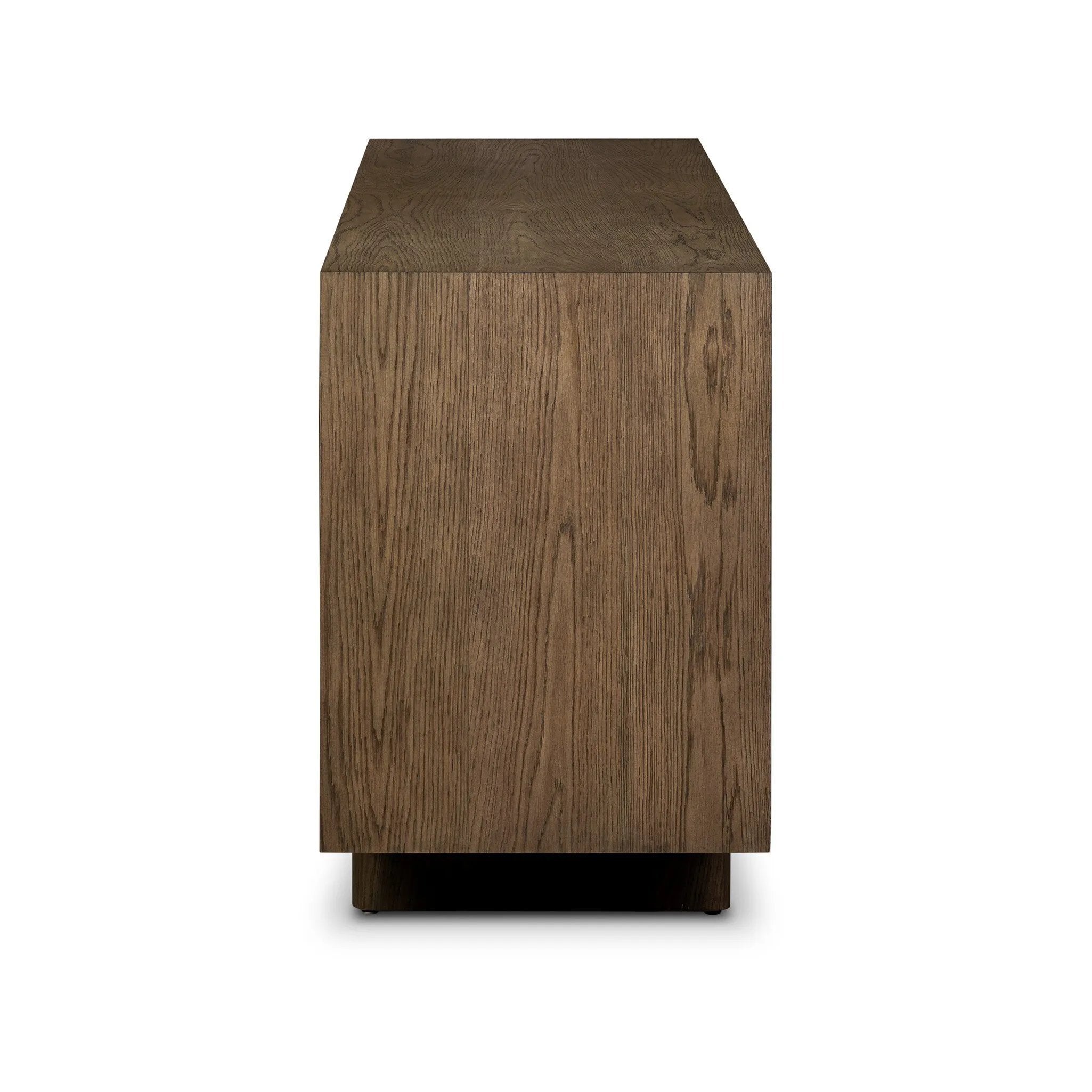 Grounding and stunning. We paired a modern frame and chunky base with door panels featuring oyster cuts of oak that take a specialized skill to create. Each cut captures the story of the wood and brings a natural, organic rhythm to the entire sideboard, and any space. Amethyst Home provides interior design, new home construction design consulting, vintage area rugs, and lighting in the Dallas metro area.