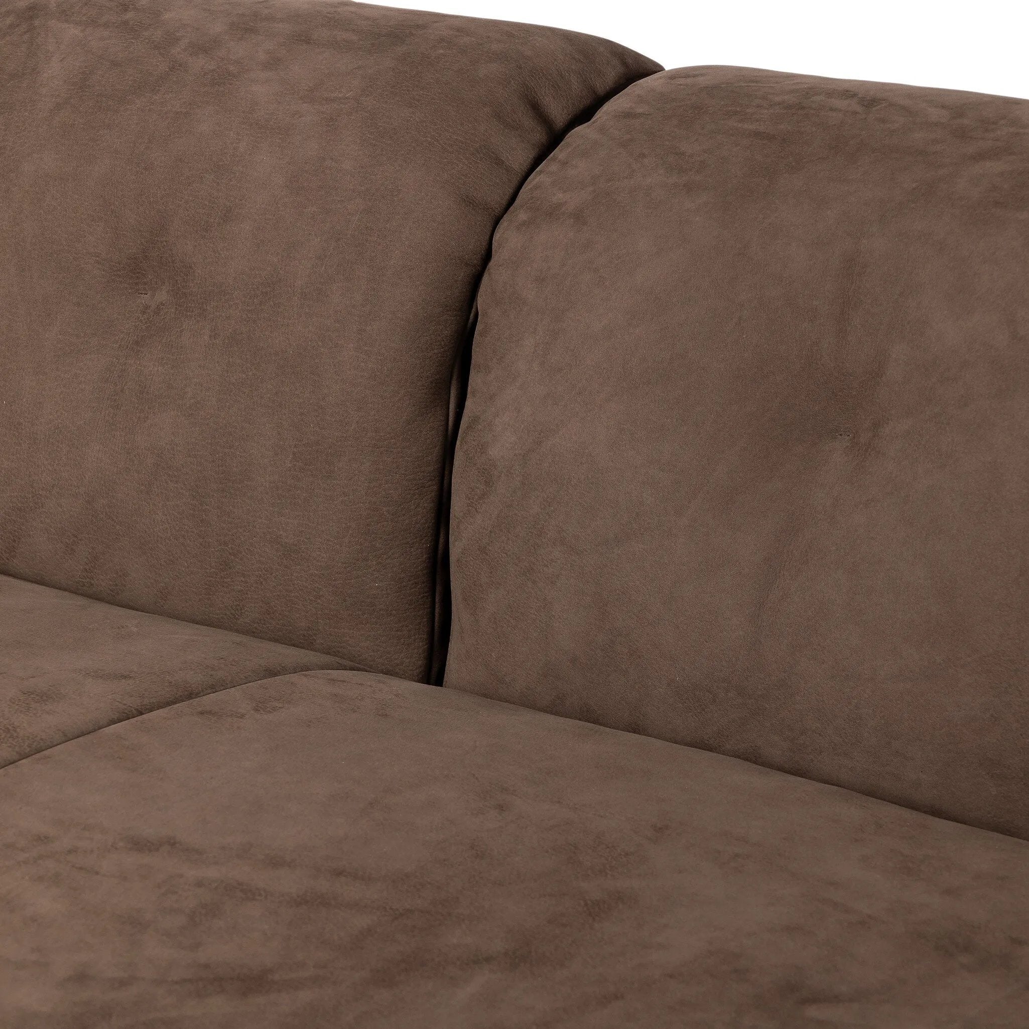 Inspired by 1970s Brutalism, this urban tuxedo sofa balances a rounded solid wood plinth with a curved seat deck and a relaxed, "wrinkled" upholstery design. Feather-blend cushions wrap the frame, finished with dramatic blind tufting for a hand-crafted, textural edge. Amethyst Home provides interior design, new home construction design consulting, vintage area rugs, and lighting in the Dallas metro area.