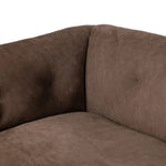 Inspired by 1970s Brutalism, this urban tuxedo sofa balances a rounded solid wood plinth with a curved seat deck and a relaxed, "wrinkled" upholstery design. Feather-blend cushions wrap the frame, finished with dramatic blind tufting for a hand-crafted, textural edge. Amethyst Home provides interior design, new home construction design consulting, vintage area rugs, and lighting in the Omaha metro area.