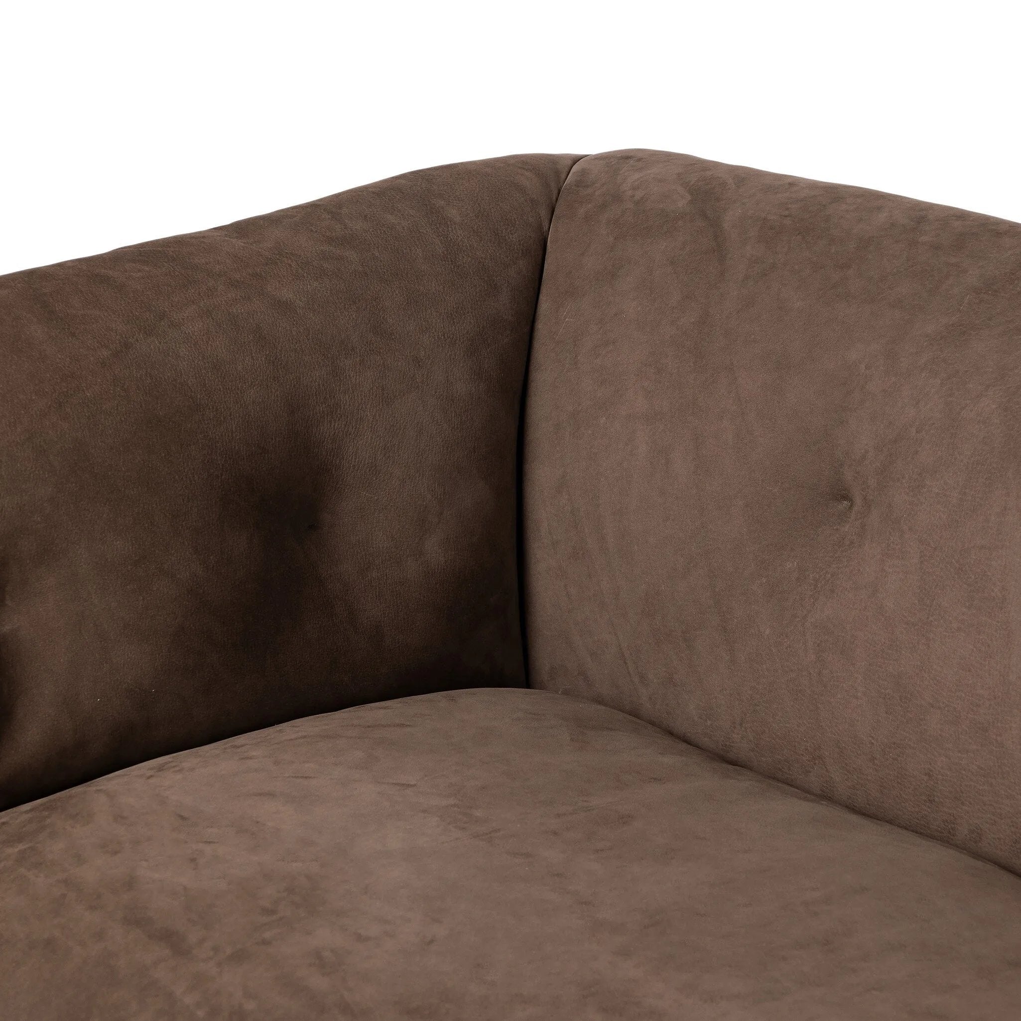 Inspired by 1970s Brutalism, this urban tuxedo sofa balances a rounded solid wood plinth with a curved seat deck and a relaxed, "wrinkled" upholstery design. Feather-blend cushions wrap the frame, finished with dramatic blind tufting for a hand-crafted, textural edge. Amethyst Home provides interior design, new home construction design consulting, vintage area rugs, and lighting in the Omaha metro area.