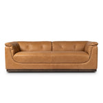 Inspired by 1970s Brutalism, this urban tuxedo sofa balances a rounded solid wood plinth with a curved seat deck and a relaxed, "wrinkled" upholstery design. Feather-blend cushions wrap the frame, finished with dramatic blind tufting for a hand-crafted, textural edge. Amethyst Home provides interior design, new home construction design consulting, vintage area rugs, and lighting in the Houston metro area.