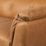Inspired by 1970s Brutalism, this urban tuxedo sofa balances a rounded solid wood plinth with a curved seat deck and a relaxed, "wrinkled" upholstery design. Feather-blend cushions wrap the frame, finished with dramatic blind tufting for a hand-crafted, textural edge. Amethyst Home provides interior design, new home construction design consulting, vintage area rugs, and lighting in the Monterey metro area.
