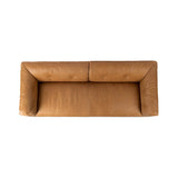 Inspired by 1970s Brutalism, this urban tuxedo sofa balances a rounded solid wood plinth with a curved seat deck and a relaxed, "wrinkled" upholstery design. Feather-blend cushions wrap the frame, finished with dramatic blind tufting for a hand-crafted, textural edge. Amethyst Home provides interior design, new home construction design consulting, vintage area rugs, and lighting in the Salt Lake City metro area.