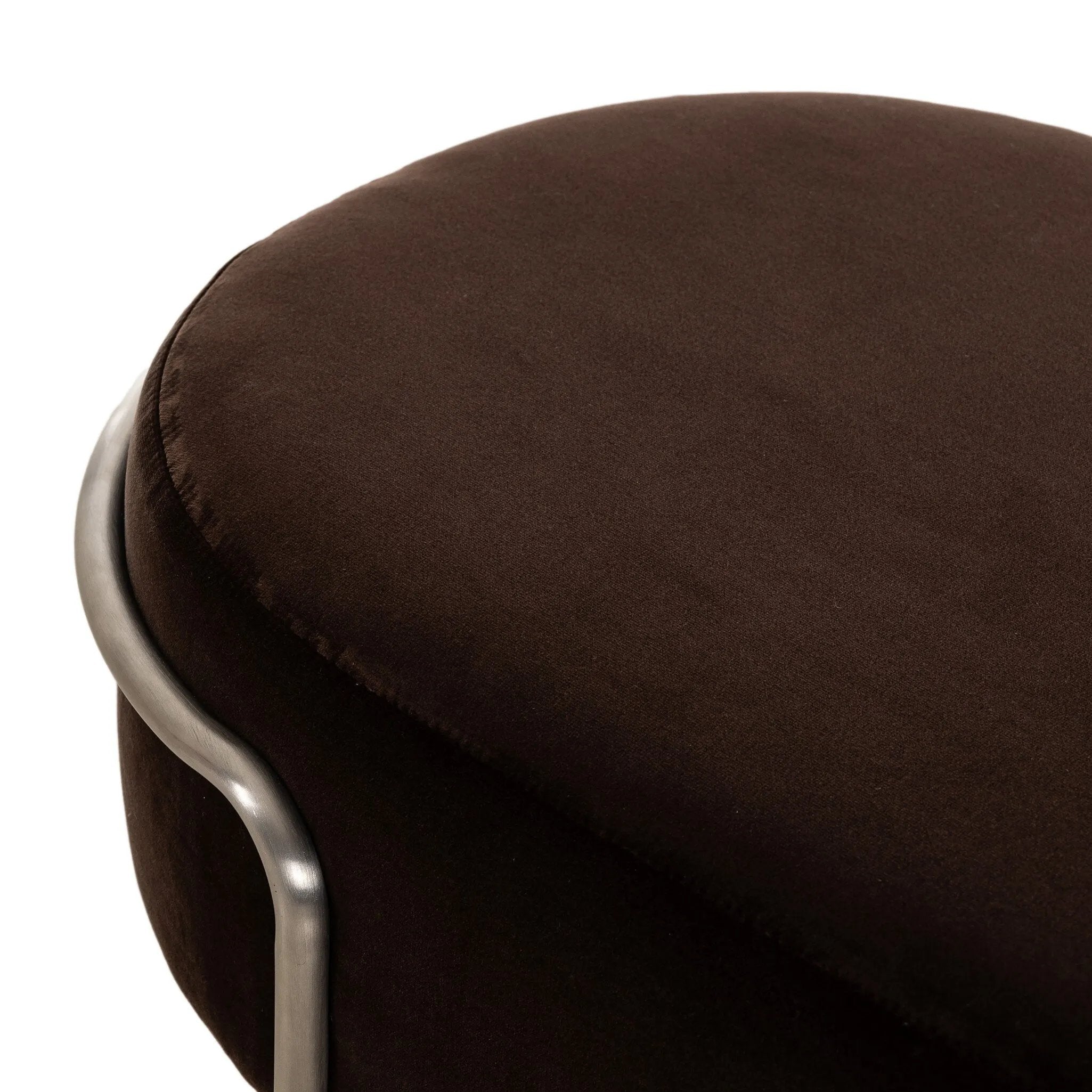 Modern vibes, playful shaping. Velvety, cocoa-colored performance fabric pairs with a silver-finished stainless steel frame. Performance fabrics are specially created to withstand spills, stains, high traffic and wear, ensuring long-term comfort and unmatched durability. Amethyst Home provides interior design, new home construction design consulting, vintage area rugs, and lighting in the Nashville metro area.