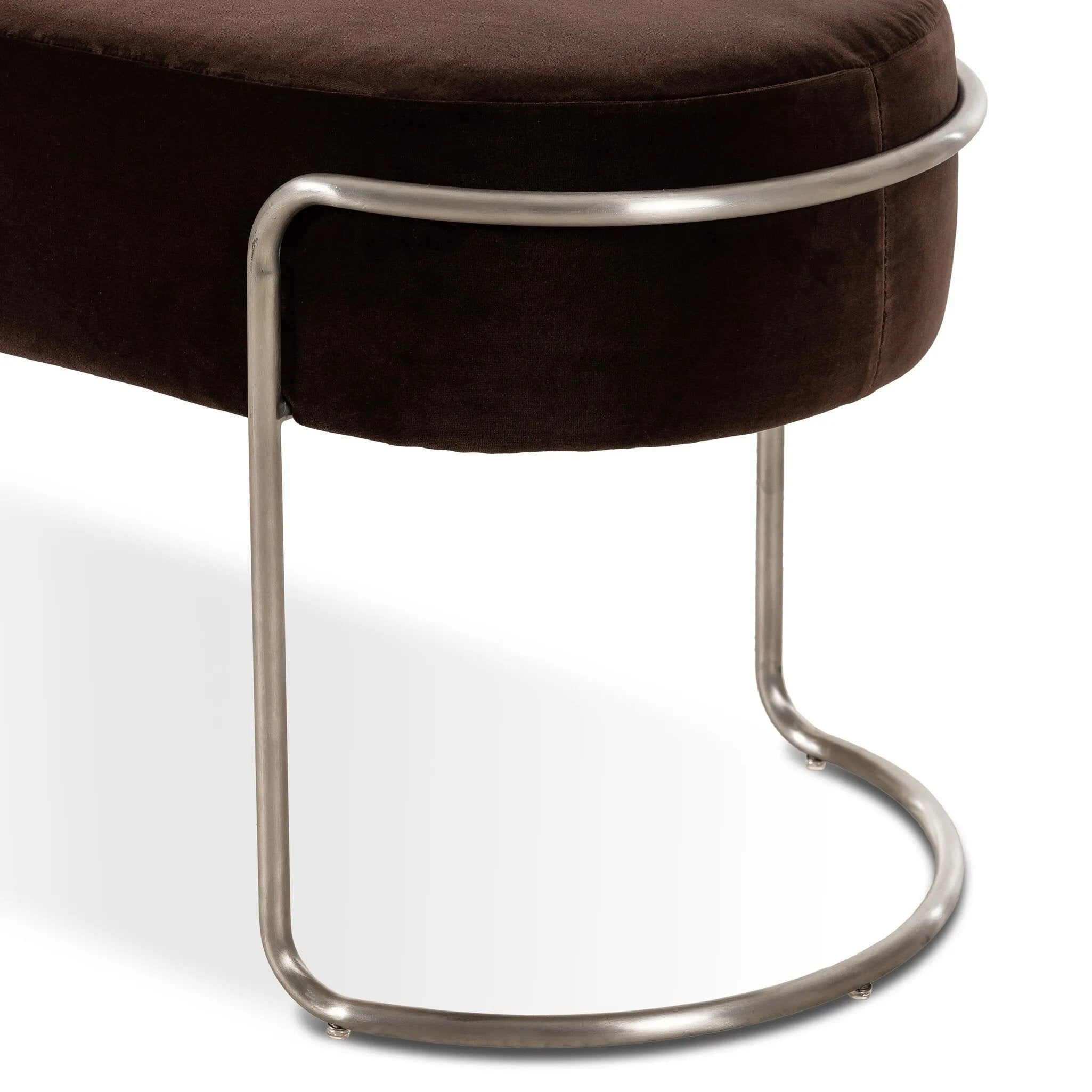 Modern vibes, playful shaping. Velvety, cocoa-colored performance fabric pairs with a silver-finished stainless steel frame. Performance fabrics are specially created to withstand spills, stains, high traffic and wear, ensuring long-term comfort and unmatched durability. Amethyst Home provides interior design, new home construction design consulting, vintage area rugs, and lighting in the Scottsdale metro area.