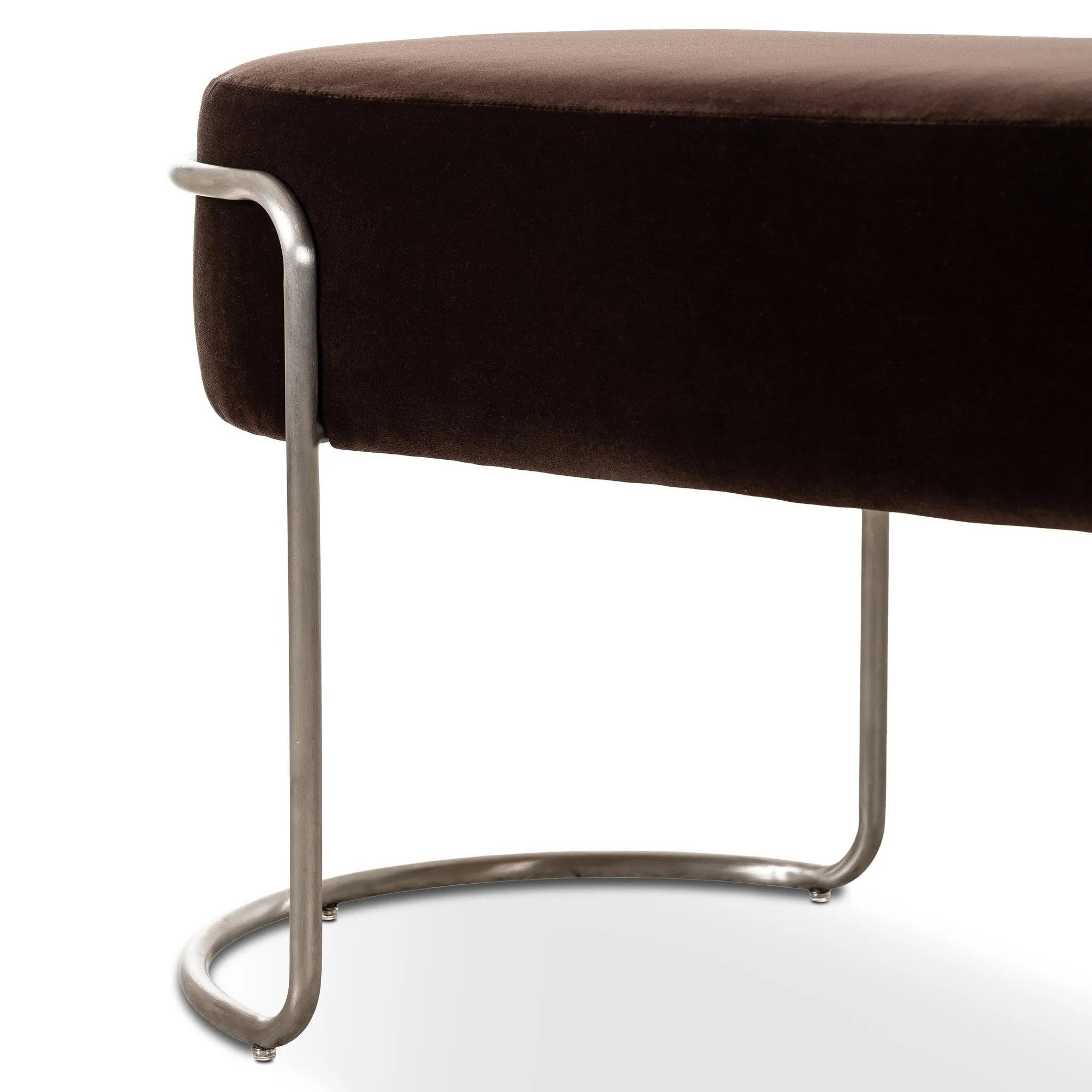 Modern vibes, playful shaping. Velvety, cocoa-colored performance fabric pairs with a silver-finished stainless steel frame. Performance fabrics are specially created to withstand spills, stains, high traffic and wear, ensuring long-term comfort and unmatched durability. Amethyst Home provides interior design, new home construction design consulting, vintage area rugs, and lighting in the Seattle metro area.