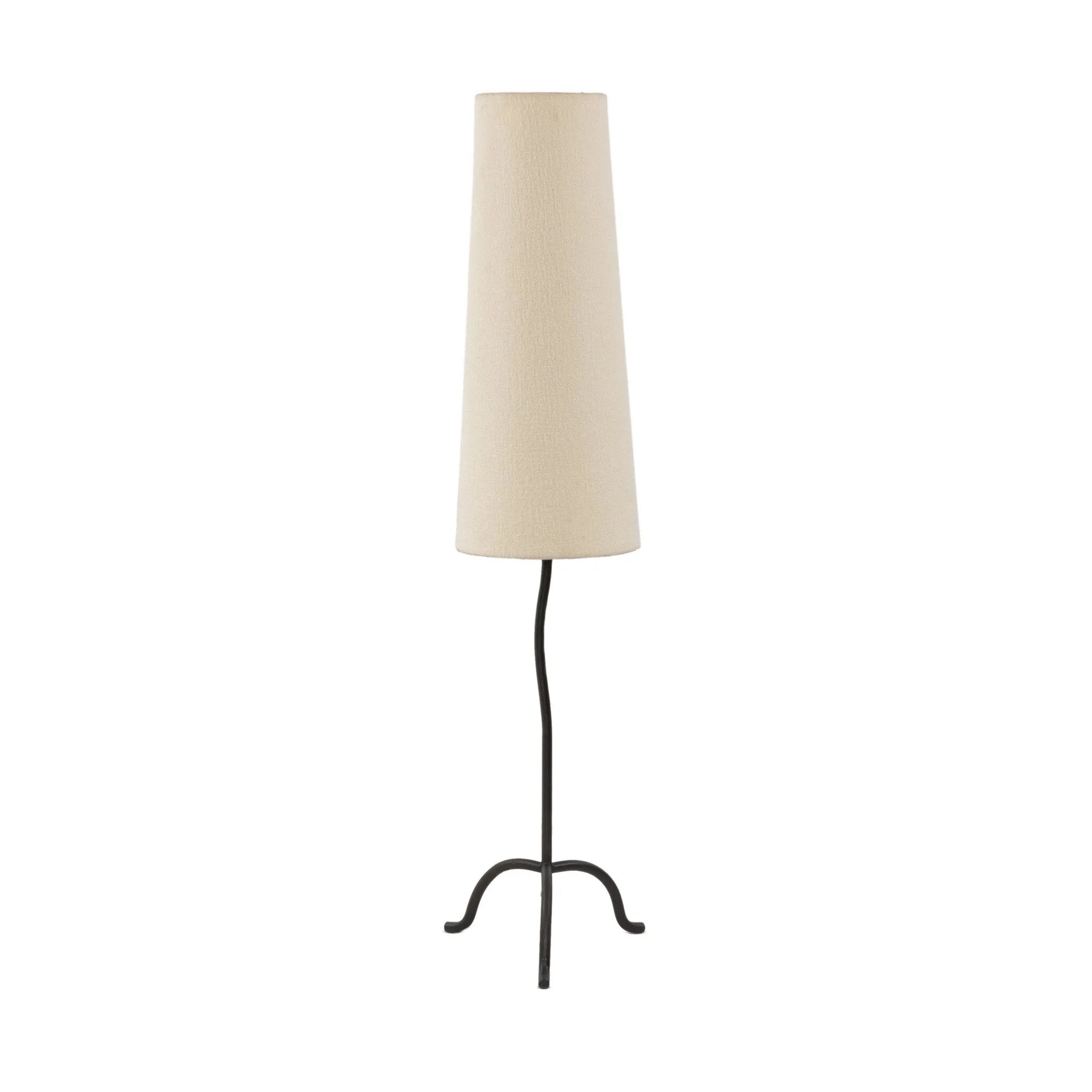 A curved cast iron tripod base pairs with an elongated boucle shade for a sculpted, minimalist look that works into any room with ease Amethyst Home provides interior design, new home construction design consulting, vintage area rugs, and lighting in the Laguna Beach metro area.