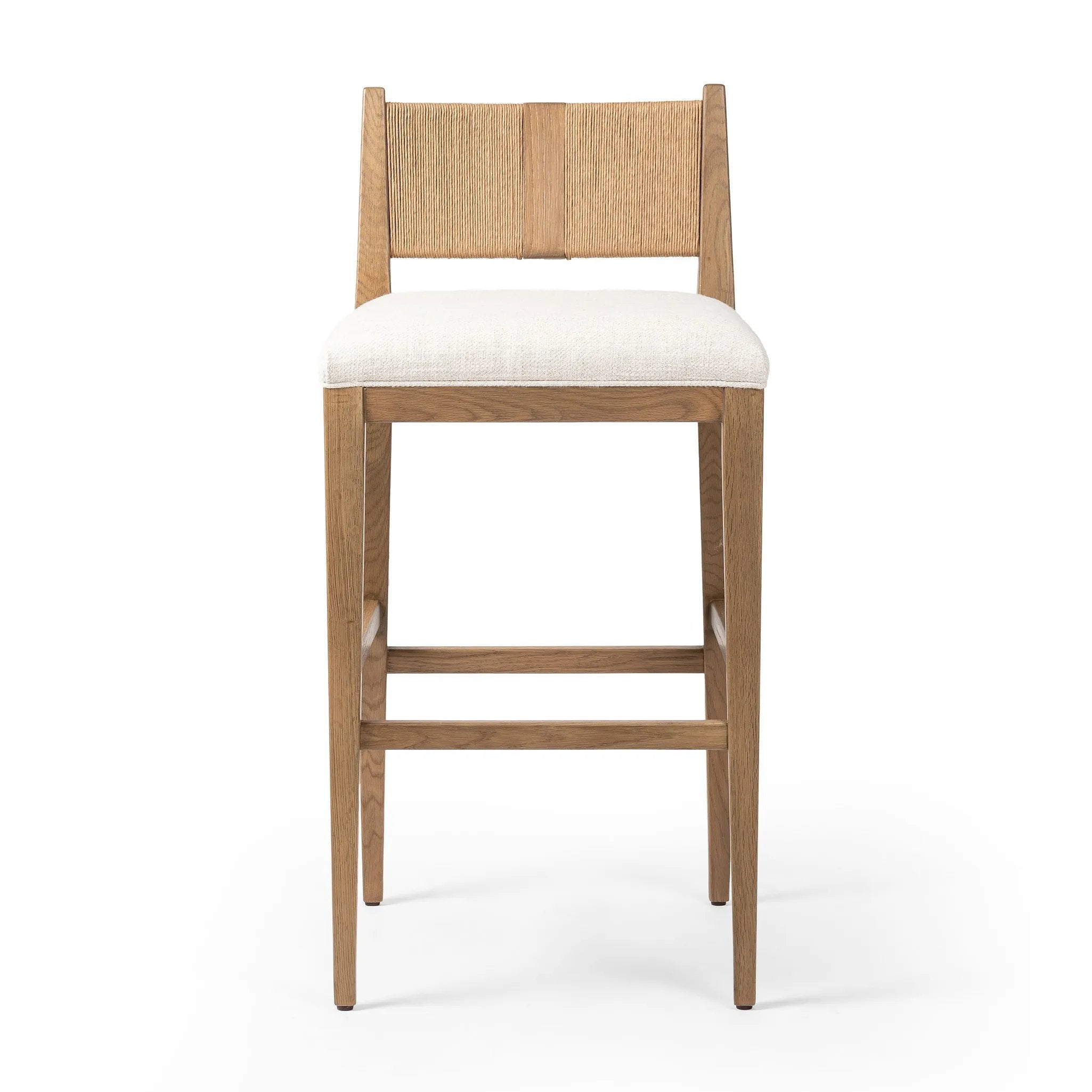 Unique materials make this bar stool a standout. A low, perfectly pitched backrest is made from wrapped paper cord and aged oak, for a natural, textured look. Simple squared seating is upholstered in high-performance fabric, perfect for entertaining. Amethyst Home provides interior design, new home construction design consulting, vintage area rugs, and lighting in the Newport Beach metro area.