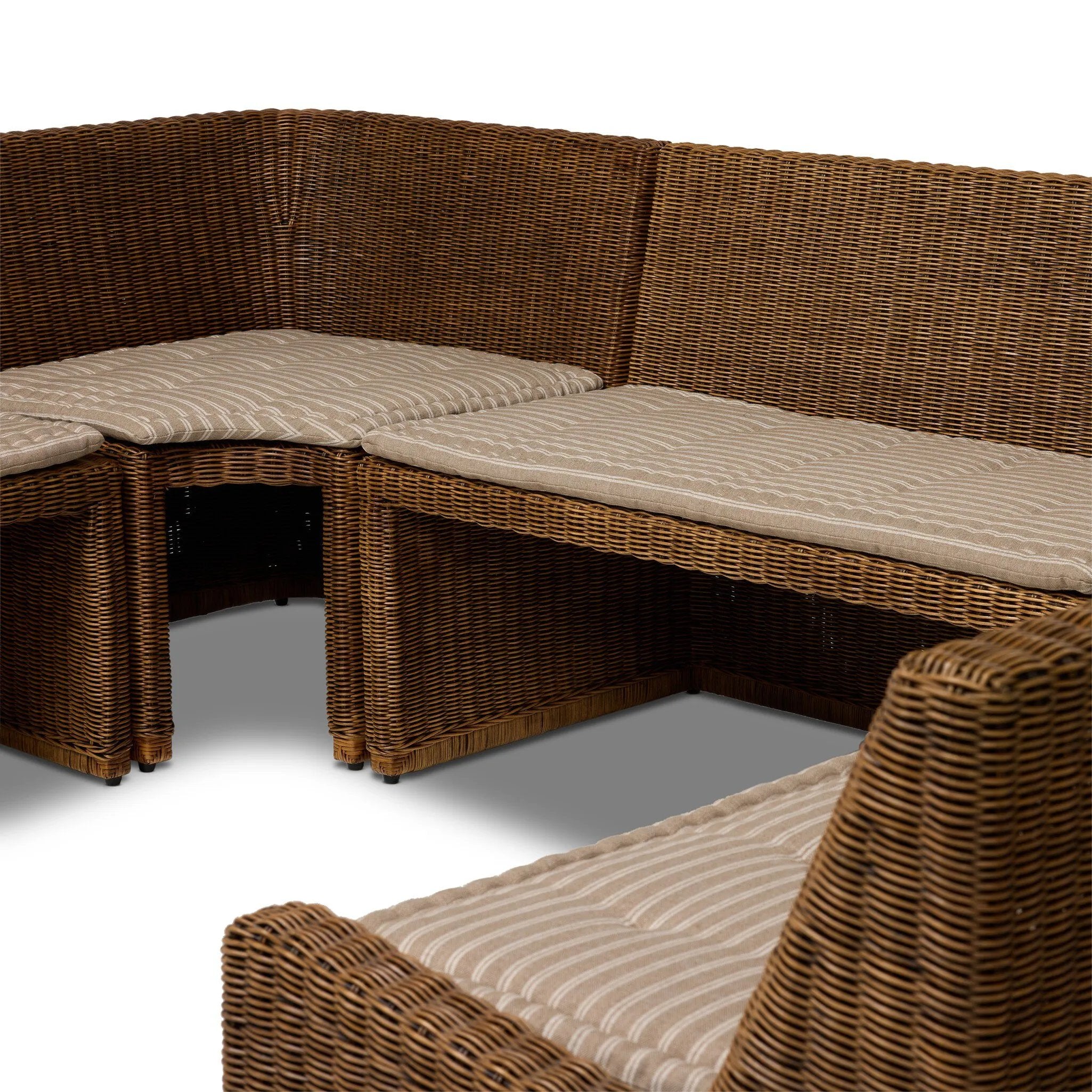 Antique-inspired coastal style. Rattan introduces varying natural shades and texture to this dining bench, and the frame's soft lines and beige and white striped fabric cushion invite a comfortable sit. Option to style alone or pair with other pieces in the collection. A design collaboration by Amber Lewis and Four Hands. Amethyst Home provides interior design, new home construction design consulting, vintage area rugs, and lighting in the Calabasas metro area.