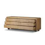 Blending modern design with classic features, this dresser is at once soft and bold. Set low to the ground on rounded feet, the dresser has prominent rounded corners that emphasize its smooth finish. Crafted from solid warm oak and veneers with push-latch hardware for a clean front Amethyst Home provides interior design, new home construction design consulting, vintage area rugs, and lighting in the Nashville metro area.