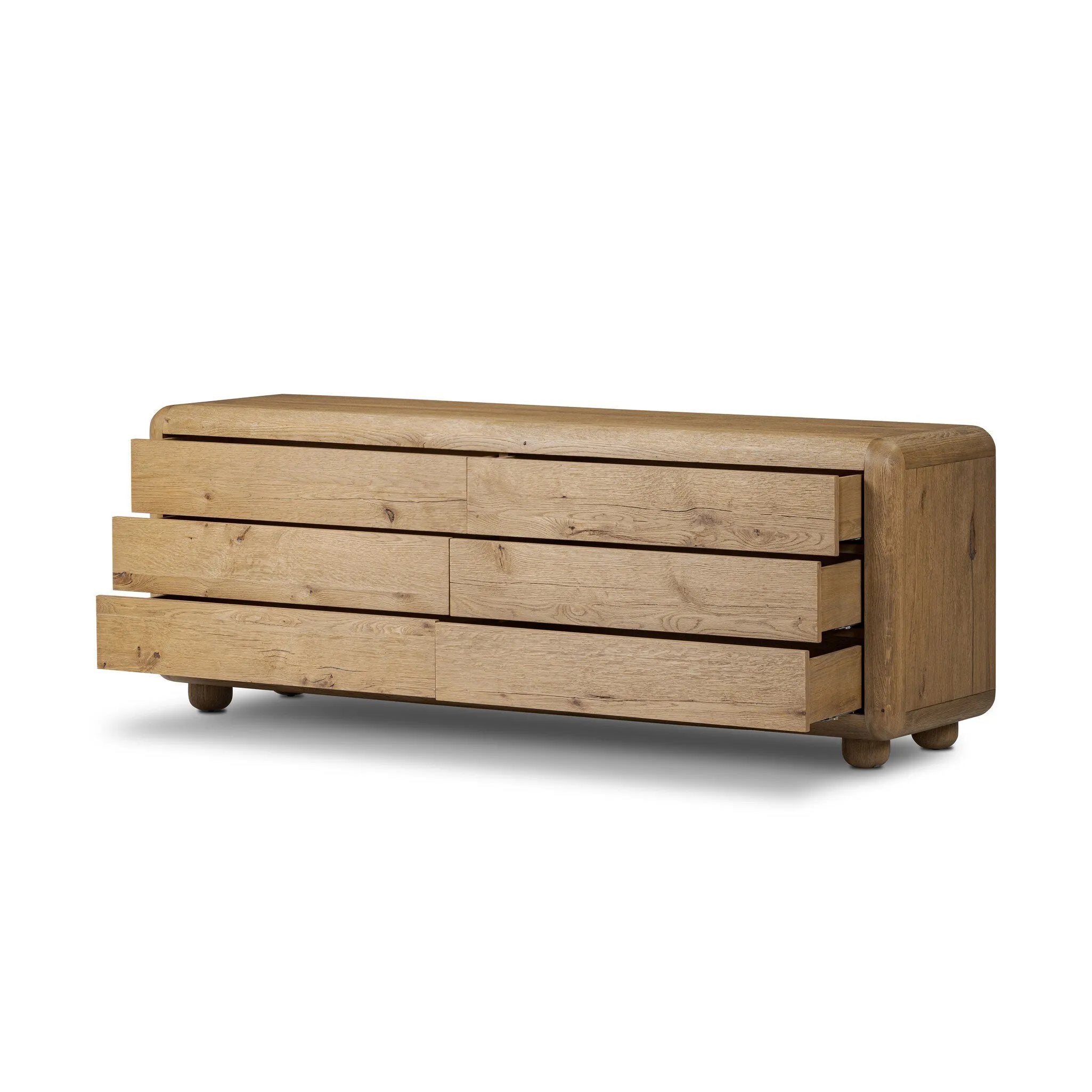 Blending modern design with classic features, this dresser is at once soft and bold. Set low to the ground on rounded feet, the dresser has prominent rounded corners that emphasize its smooth finish. Crafted from solid warm oak and veneers with push-latch hardware for a clean front Amethyst Home provides interior design, new home construction design consulting, vintage area rugs, and lighting in the Nashville metro area.