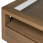 Bring bonus storage and a light look to the living space. Made from sandy oak and clear tempered glass with two roomy drawers on either side of the base, plus shelving beneath the glass that doubles as a shadowbox or an extra display surface.As lovers of luxe design at Amethyst, we love the warm modern inspired Shiloh Coffee Table - Tempered Glass. Amethyst Home provides interior design, new home construction design consulting, vintage area rugs, and lighting in the Alpharetta metro area.