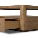 Bring bonus storage and a light look to the living space. Made from sandy oak and clear tempered glass with two roomy drawers on either side of the base, plus shelving beneath the glass that doubles as a shadowbox or an extra display surface.As lovers of luxe design at Amethyst, we love the warm modern inspired Shiloh Coffee Table - Tempered Glass. Amethyst Home provides interior design, new home construction design consulting, vintage area rugs, and lighting in the Laguna Beach metro area.