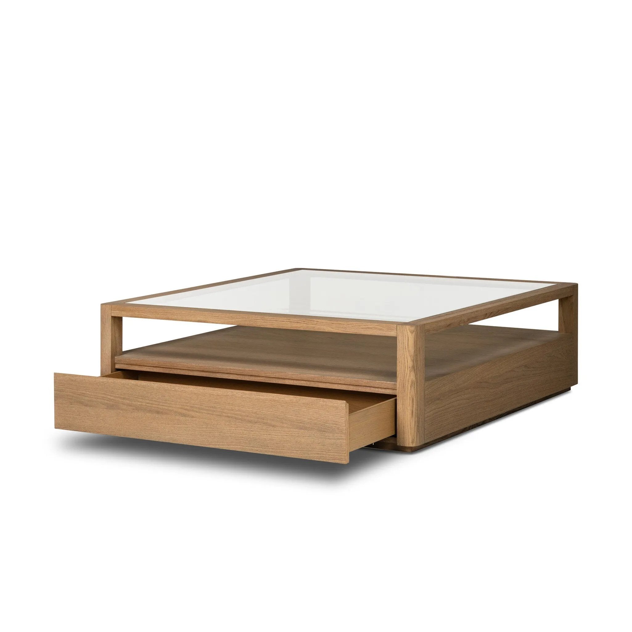 Bring bonus storage and a light look to the living space. Made from sandy oak and clear tempered glass with two roomy drawers on either side of the base, plus shelving beneath the glass that doubles as a shadowbox or an extra display surface.As lovers of luxe design at Amethyst, we love the warm modern inspired Shiloh Coffee Table - Tempered Glass. Amethyst Home provides interior design, new home construction design consulting, vintage area rugs, and lighting in the Omaha metro area.