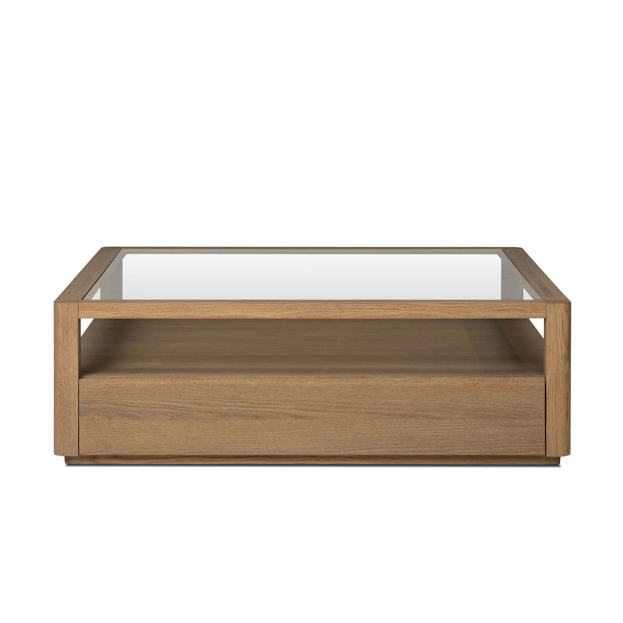 Bring bonus storage and a light look to the living space. Made from sandy oak and clear tempered glass with two roomy drawers on either side of the base, plus shelving beneath the glass that doubles as a shadowbox or an extra display surface.As lovers of luxe design at Amethyst, we love the warm modern inspired Shiloh Coffee Table - Tempered Glass. Amethyst Home provides interior design, new home construction design consulting, vintage area rugs, and lighting in the Salt Lake City metro area.