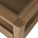 Bring bonus storage and a light look to the living space. Made from sandy oak and clear tempered glass with two roomy drawers on either side of the base, plus shelving beneath the glass that doubles as a shadowbox or an extra display surface.As lovers of luxe design at Amethyst, we love the warm modern inspired Shiloh Coffee Table - Tempered Glass. Amethyst Home provides interior design, new home construction design consulting, vintage area rugs, and lighting in the San Diego metro area.