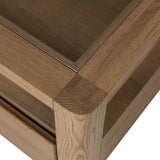 Bring bonus storage and a light look to the living space. Made from sandy oak and clear tempered glass with two roomy drawers on either side of the base, plus shelving beneath the glass that doubles as a shadowbox or an extra display surface.As lovers of luxe design at Amethyst, we love the warm modern inspired Shiloh Coffee Table - Tempered Glass. Amethyst Home provides interior design, new home construction design consulting, vintage area rugs, and lighting in the San Diego metro area.