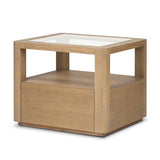 Bring bonus storage and a light look to the living space. Made from sandy oak and clear tempered glass with a single drawer, shelving beneath the glass doubles as a shadowbox or an extra display surface.As lovers of clean materials at Amethyst, we love the designer inspired Shiloh End Table - Tempered Glass. Amethyst Home provides interior design, new home construction design consulting, vintage area rugs, and lighting in the Omaha metro area.