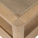 Bring bonus storage and a light look to the living space. Made from sandy oak and clear tempered glass with a single drawer, shelving beneath the glass doubles as a shadowbox or an extra display surface.As lovers of clean materials at Amethyst, we love the designer inspired Shiloh End Table - Tempered Glass. Amethyst Home provides interior design, new home construction design consulting, vintage area rugs, and lighting in the San Diego metro area.