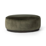 Featuring Sinclair Surrey Olive Large Round Ottoman by Four Hands at Amethyst Home. Upholstered in a deep olive velvet and paired with a  rich brown base, this wide, round ottoman can be placed just about anywhere – bringing with it a luxe vibe. Style with a tray as a design-forward coffee table.Overall Dimensions: 36.00"w x 36.00"d x 14.50"hWeight : 26.. Amethyst Home provides interior design, new home construction design consulting, vintage area rugs, and lighting in the Laguna Beach metro area.