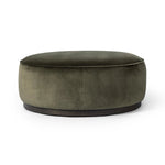 Featuring Sinclair Surrey Olive Large Round Ottoman by Four Hands at Amethyst Home. Upholstered in a deep olive velvet and paired with a  rich brown base, this wide, round ottoman can be placed just about anywhere – bringing with it a luxe vibe. Style with a tray as a design-forward coffee table.Overall Dimensions: 36.00"w x 36.00"d x 14.50"hWeight : 26.46 lb. Amethyst Home provides interior design, new home construction design consulting, vintage area rugs, and lighting in the Seattle metro area.