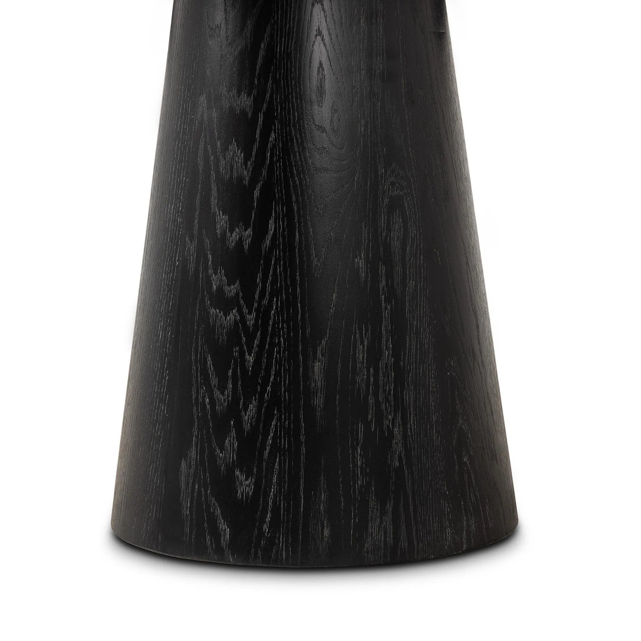 Mixed materials make for great drama. A cone-tapered base of dark oak supports a rounded tabletop of solid bluestone, with oak banding on the edges for thoughtful contrast Amethyst Home provides interior design, new home construction design consulting, vintage area rugs, and lighting in the San Diego metro area.