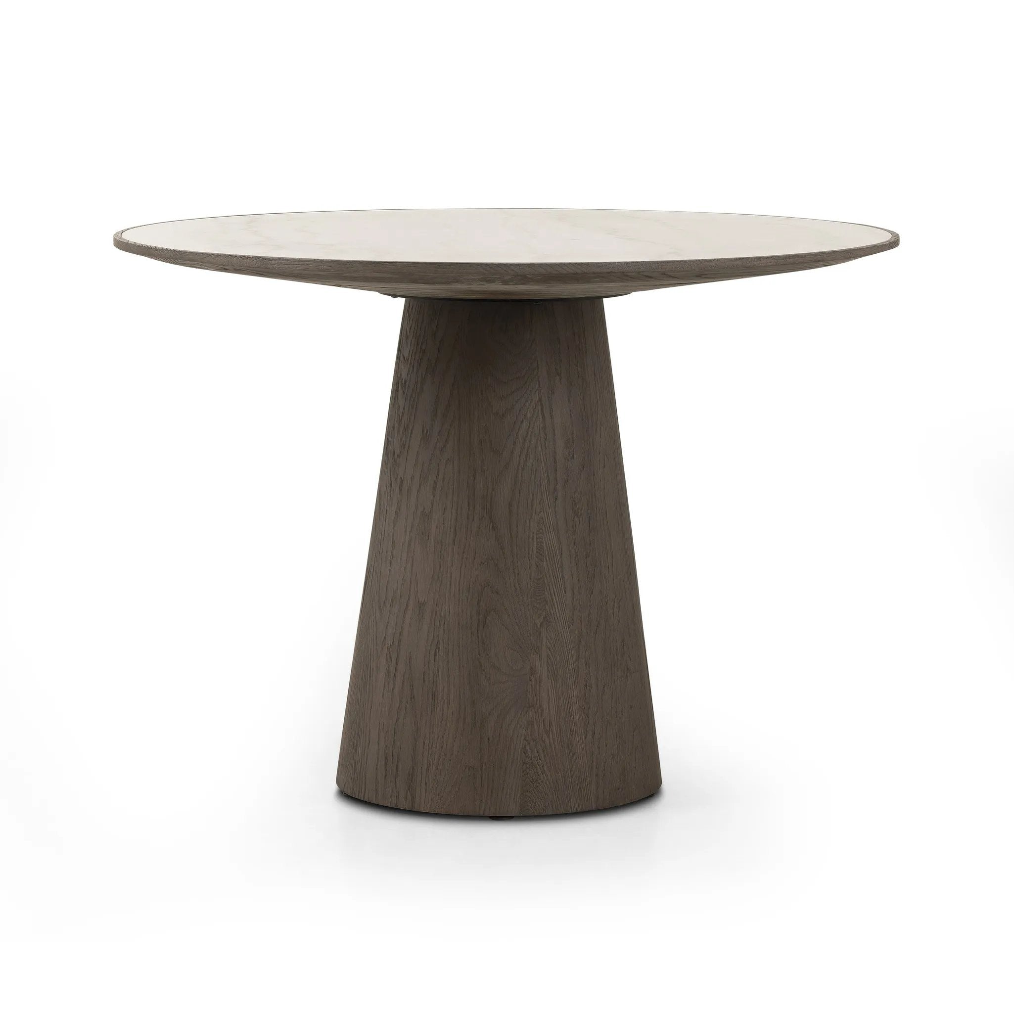 Featuring Skye White Marble Round Dining Table by Four Hands at Amethyst Home. Mixed materials make for great drama. A cone-tapered base of dark, weathered oak supports a rounded tabletop of white-finished solid marble, with oak banding on the edges for thoughtful contrast.Overall Dimensions: 42.00"w x 42.00"d x 30.00"hWeight : 158.73 lbsMaterials : Solid Marb. Amethyst Home provides interior design, new home construction design consulting, vintage area rugs, and lighting in the Boston metro area.