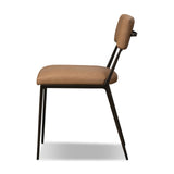 Bring a slim, light look to the dining room. This dining chair pairs camel top-grain leather and bronzed iron to craft a simple, airy look. A tapered leg and decorative handle on the back elevate the look.As enthusiasts of natural materials at Amethyst, we love the warm modern inspired Somerson Dining Chair - Maestro Camel. Amethyst Home provides interior design, new home construction design consulting, vintage area rugs, and lighting in the Miami metro area.
