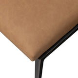 Bring a slim, light look to the dining room. This dining chair pairs camel top-grain leather and bronzed iron to craft a simple, airy look. A tapered leg and decorative handle on the back elevate the look.As enthusiasts of natural materials at Amethyst, we love the warm modern inspired Somerson Dining Chair - Maestro Camel. Amethyst Home provides interior design, new home construction design consulting, vintage area rugs, and lighting in the Newport Beach metro area.