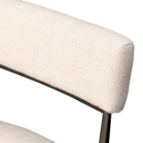 Bring a slim, light look to the dining room. This dining chair pairs cream performance fabric exclusive to Four Hands and bronzed iron to craft a simple, airy look. A tapered leg and decorative handle on the back elevate the look. Amethyst Home provides interior design, new home construction design consulting, vintage area rugs, and lighting in the Kansas City metro area.