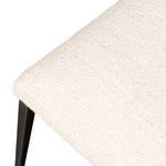 Bring a slim, light look to the dining room. This dining chair pairs cream performance fabric exclusive to Four Hands and bronzed iron to craft a simple, airy look. A tapered leg and decorative handle on the back elevate the look. Amethyst Home provides interior design, new home construction design consulting, vintage area rugs, and lighting in the Seattle metro area.