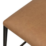 Bring a slim, light look to the dining room. This counter stool pairs camel top-grain leather and bronzed iron to craft a simple, airy look. A tapered leg and decorative handle on the back elevate the look.As fans of organic modern materials at Amethyst, we love the optimistic inspired Somerson Stool - Counter. Amethyst Home provides interior design, new home construction design consulting, vintage area rugs, and lighting in the Nashville metro area.