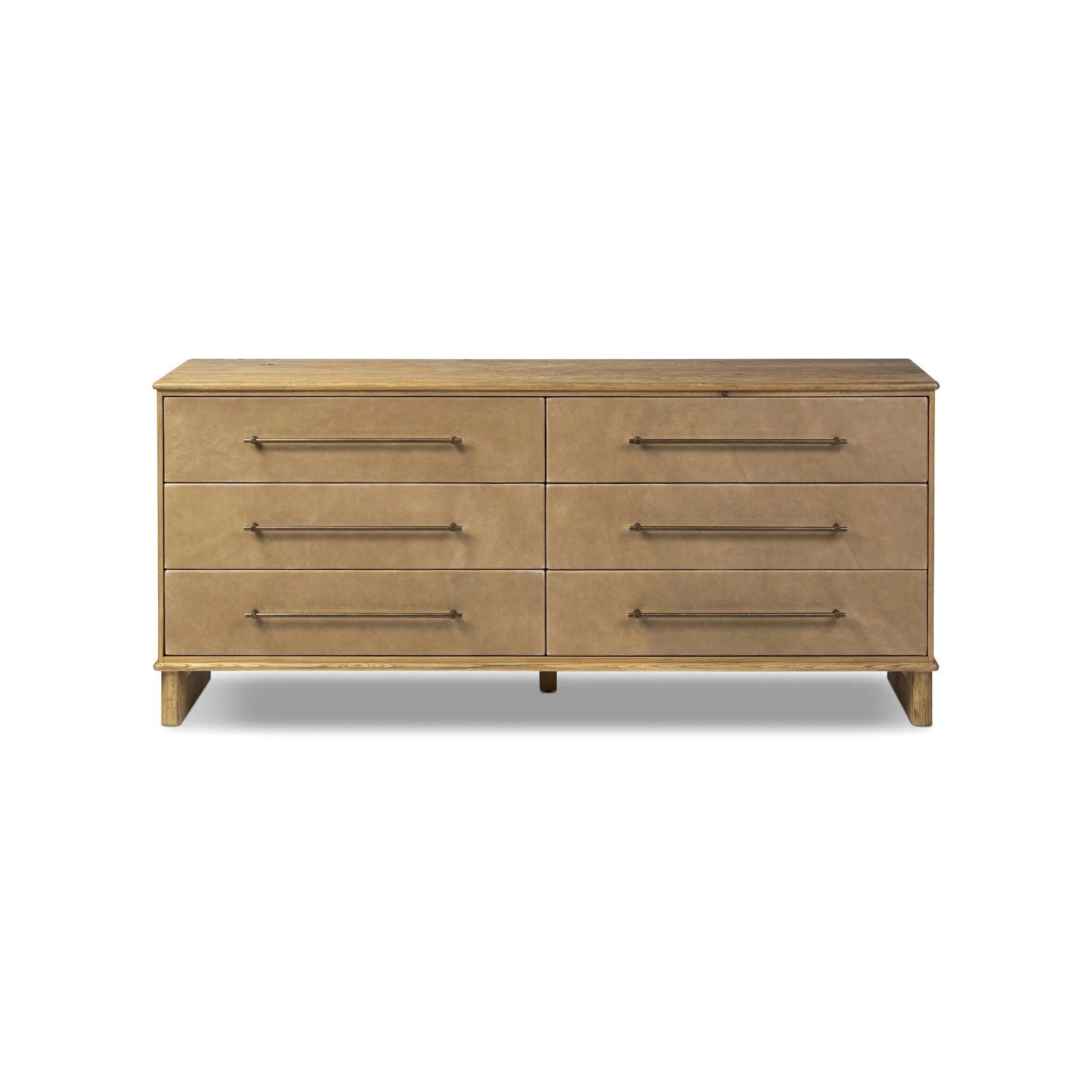 Bring a Nordic, material-driven look to your bedroom with a six-drawer dresser of grain-rich oak and drawer fronts covered with tan top-grain leather. Finished out with long, linear iron hardware Amethyst Home provides interior design, new home construction design consulting, vintage area rugs, and lighting in the Nashville metro area.