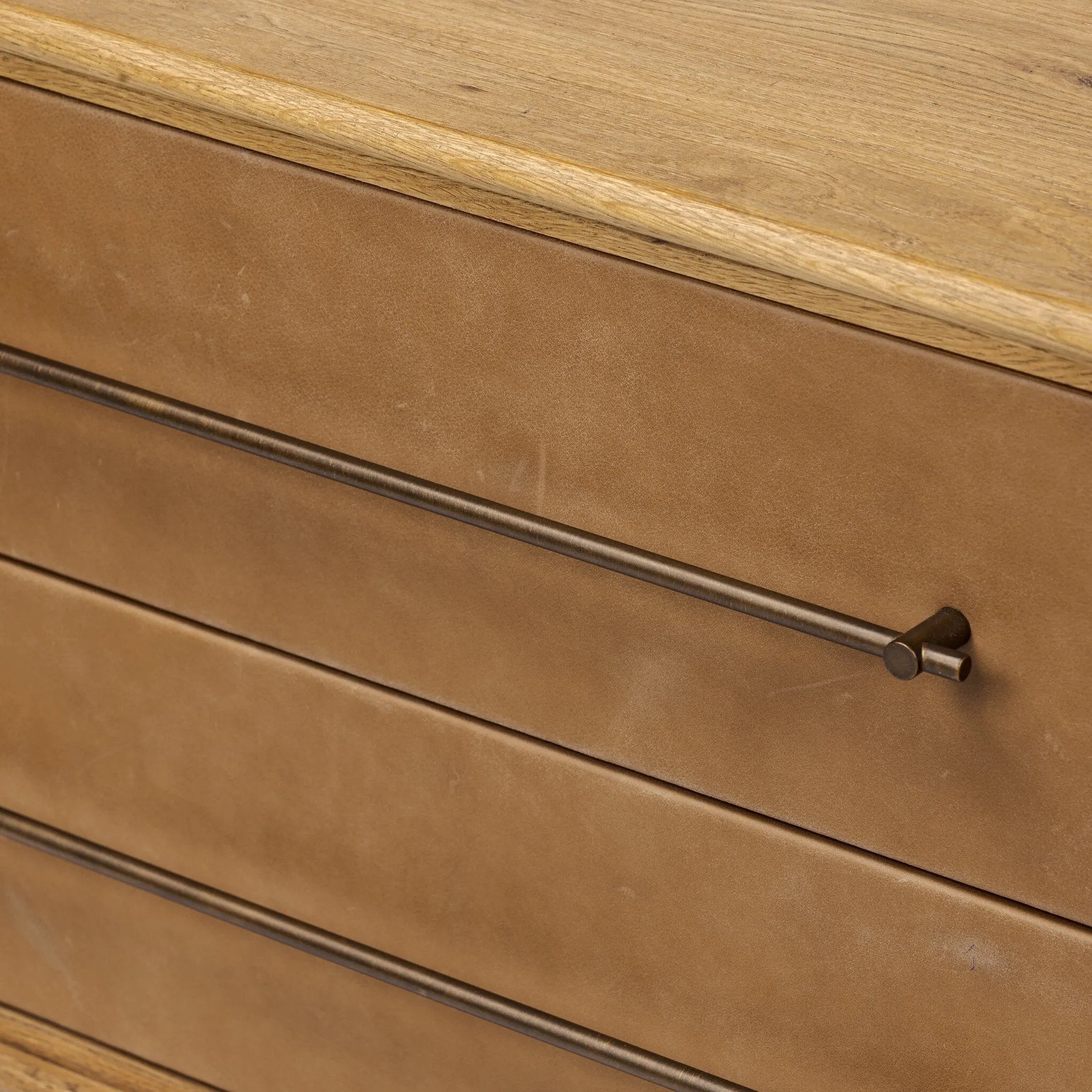 Featuring Stella Hazel Oak Veneer Nightstand by Four Hands at Amethyst Home. Bring a Nordic-inspired look to your bedroom styling. A spacious two-drawer nightstand of thick, grain-rich oak veneer encases drawer fronts covered with tan top-grain leather exclusive to Four Hands. Finished out with long, linear iron hardware. Overall Dimensions: 28.00"w x 19.50". Amethyst Home provides interior design, new home construction design consulting, vintage area rugs, and lighting in the Portland metro area.