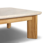 Grade A teak is fine sanded into a soft, unfinished look that highlights the wood's natural grain, finished with rounded legs that angle inward. Topped with neutral travertine stone for a blend of materials. Cover or store inside during inclement weather and when not in use. Amethyst Home provides interior design, new home construction design consulting, vintage area rugs, and lighting in the Dallas metro area.