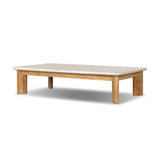 Grade A teak is fine sanded into a soft, unfinished look that highlights the wood's natural grain, finished with rounded legs that angle inward. Topped with neutral travertine stone for a blend of materials. Cover or store inside during inclement weather and when not in use. Amethyst Home provides interior design, new home construction design consulting, vintage area rugs, and lighting in the Miami metro area.