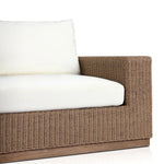Featuring Suri Arashi Salt Outdoor Sofa 106" by Four Hands at Amethyst Home. Elevate your outdoors. A wide-format outdoor sofa features a faux hyacinth frame and plinth base. Linear details and a boxy silhouette make this piece truly timeless, while knife-edge back cushions soften the whole look. Upholstered in 100% olefin, known for its UV-resistant, water-rep. Amethyst Home provides interior design, new home construction design consulting, vintage area rugs, and lighting in the Omaha metro area.