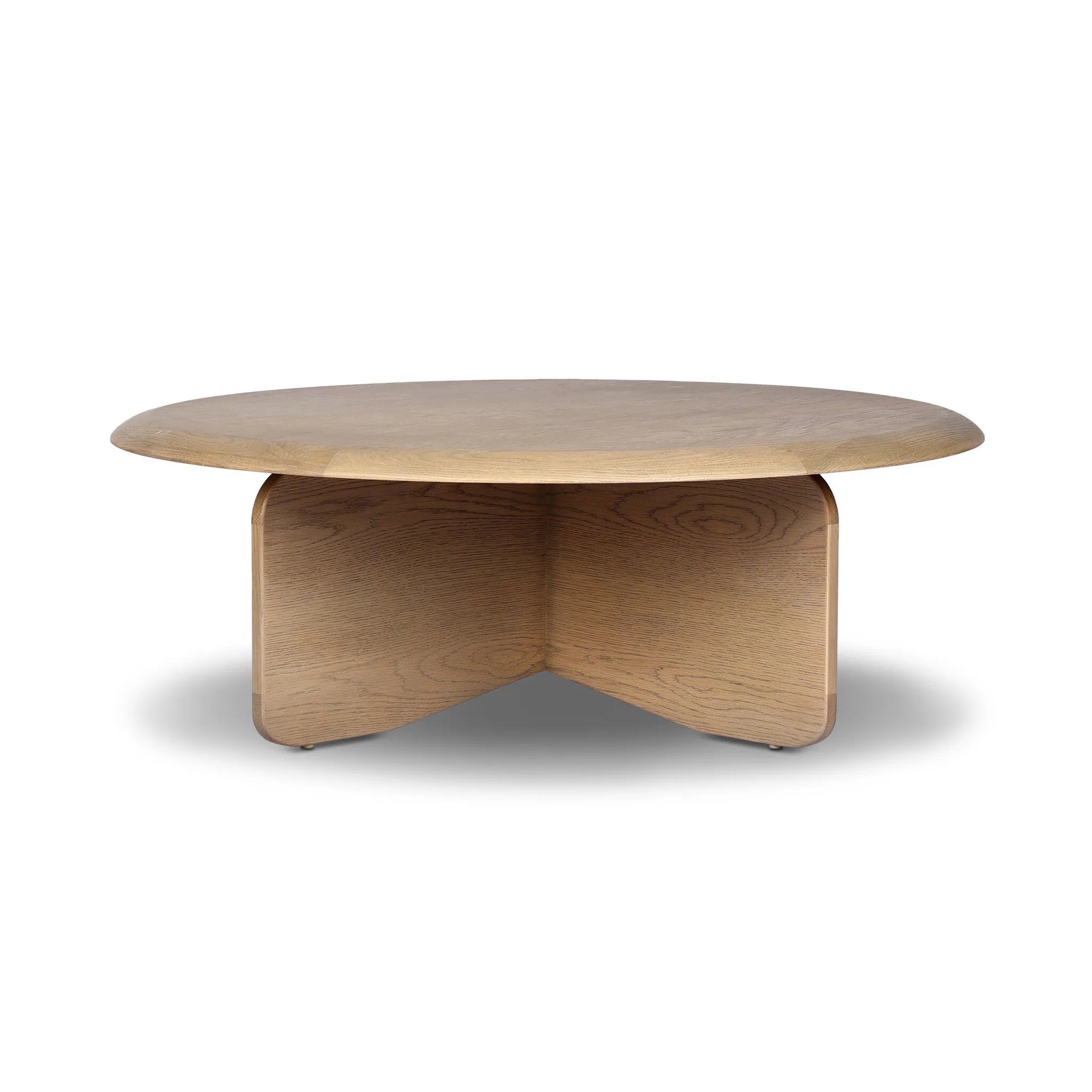 Featuring Surie Sandy Oak Resawn Coffee Table by Four Hands at Amethyst Home. A shape-driven piece inspired by clean Nordic design. Softened edges and a curved base craft a sense of flow, accentuated by cathedral grain oak with beautiful natural warmth. Overall Dimensions: 48.00"w x 48.00"d x 16.50"h. Amethyst Home provides interior design, new home construction design consulting, vintage area rugs, and lighting in the Kansas City metro area.