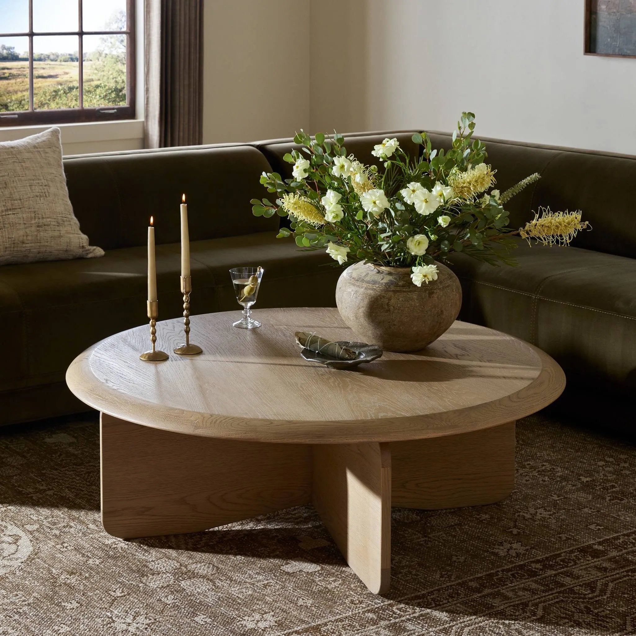 A shape-driven piece inspired by clean Nordic design. Softened edges and a curved base craft a sense of flow, accentuated by cathedral grain oak with beautiful natural warmth Amethyst Home provides interior design, new home construction design consulting, vintage area rugs, and lighting in the Los Angeles metro area.