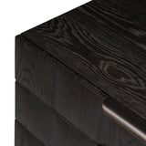 A softened Brutalist take on the traditional nightstand. The monolithic piece’s black oak veneer case sits atop a matching pedestal for an element of exaggeration. A grid pattern with inflated volume adds drama.As enthusiasts of luxe materials at Amethyst, we love the warm modern inspired Swell Nightstand - Dry Black Oak Veneer. Amethyst Home provides interior design, new home construction design consulting, vintage area rugs, and lighting in the Austin metro area.