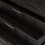 A softened Brutalist take on the traditional nightstand. The monolithic piece’s black oak veneer case sits atop a matching pedestal for an element of exaggeration. A grid pattern with inflated volume adds drama.As enthusiasts of luxe materials at Amethyst, we love the warm modern inspired Swell Nightstand - Dry Black Oak Veneer. Amethyst Home provides interior design, new home construction design consulting, vintage area rugs, and lighting in the Charlotte metro area.