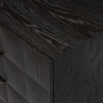 A softened Brutalist take on the traditional nightstand. The monolithic piece’s black oak veneer case sits atop a matching pedestal for an element of exaggeration. A grid pattern with inflated volume adds drama.As enthusiasts of luxe materials at Amethyst, we love the warm modern inspired Swell Nightstand - Dry Black Oak Veneer. Amethyst Home provides interior design, new home construction design consulting, vintage area rugs, and lighting in the Seattle metro area.
