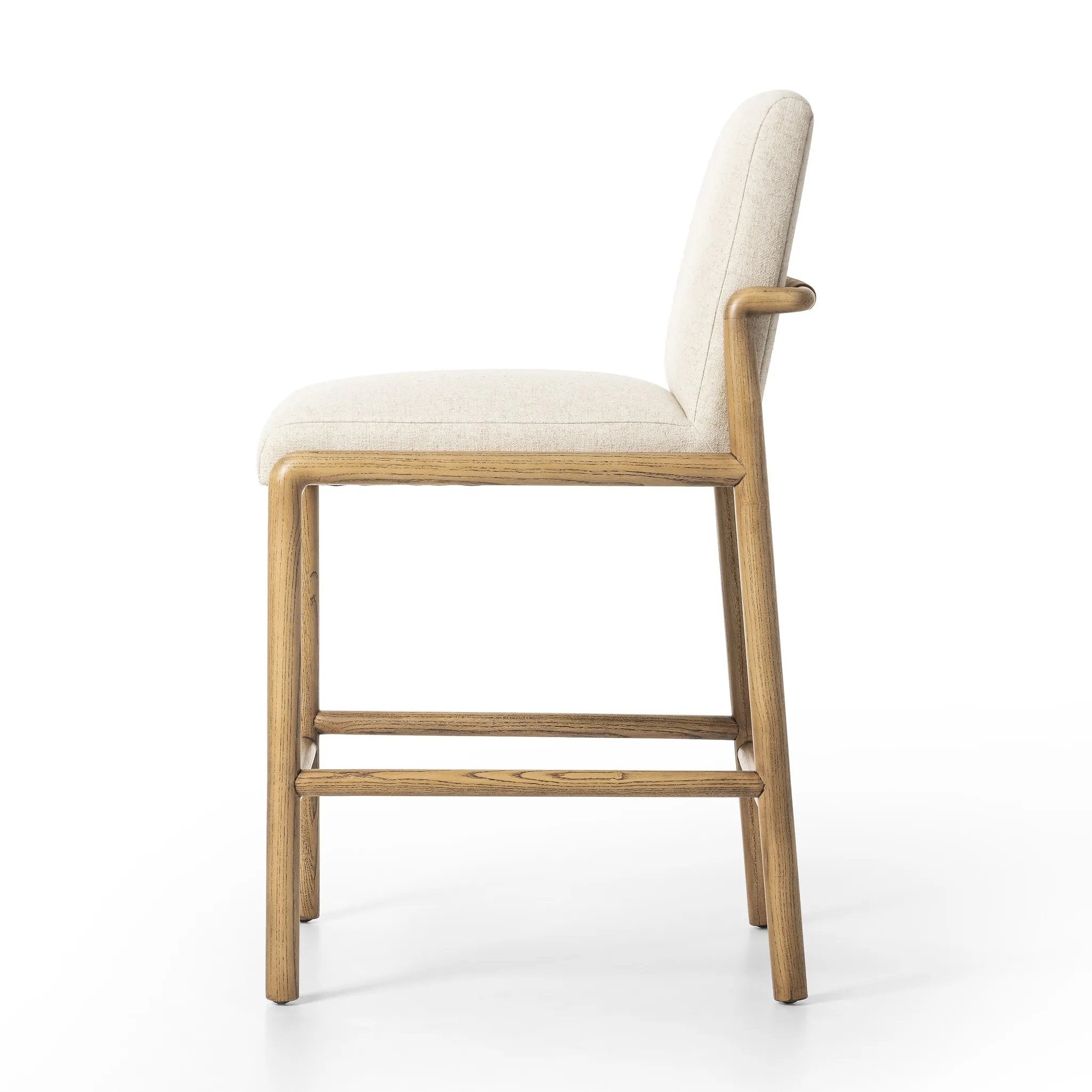 Featuring Taki Antwerp Natural Bar + Counter Stool by Four Hands at Amethyst Home. A fluid nettlewood frame cradles a comfortable cushion in a high-performance linen blend. At the back of the chair, a fabric covered handle adds architectural interest to a seamless form. Perfectly sized for the counter. Performance fabrics are specially created to withstand sp. Amethyst Home provides interior design, new home construction design consulting, vintage area rugs, and lighting in the Houston metro area.