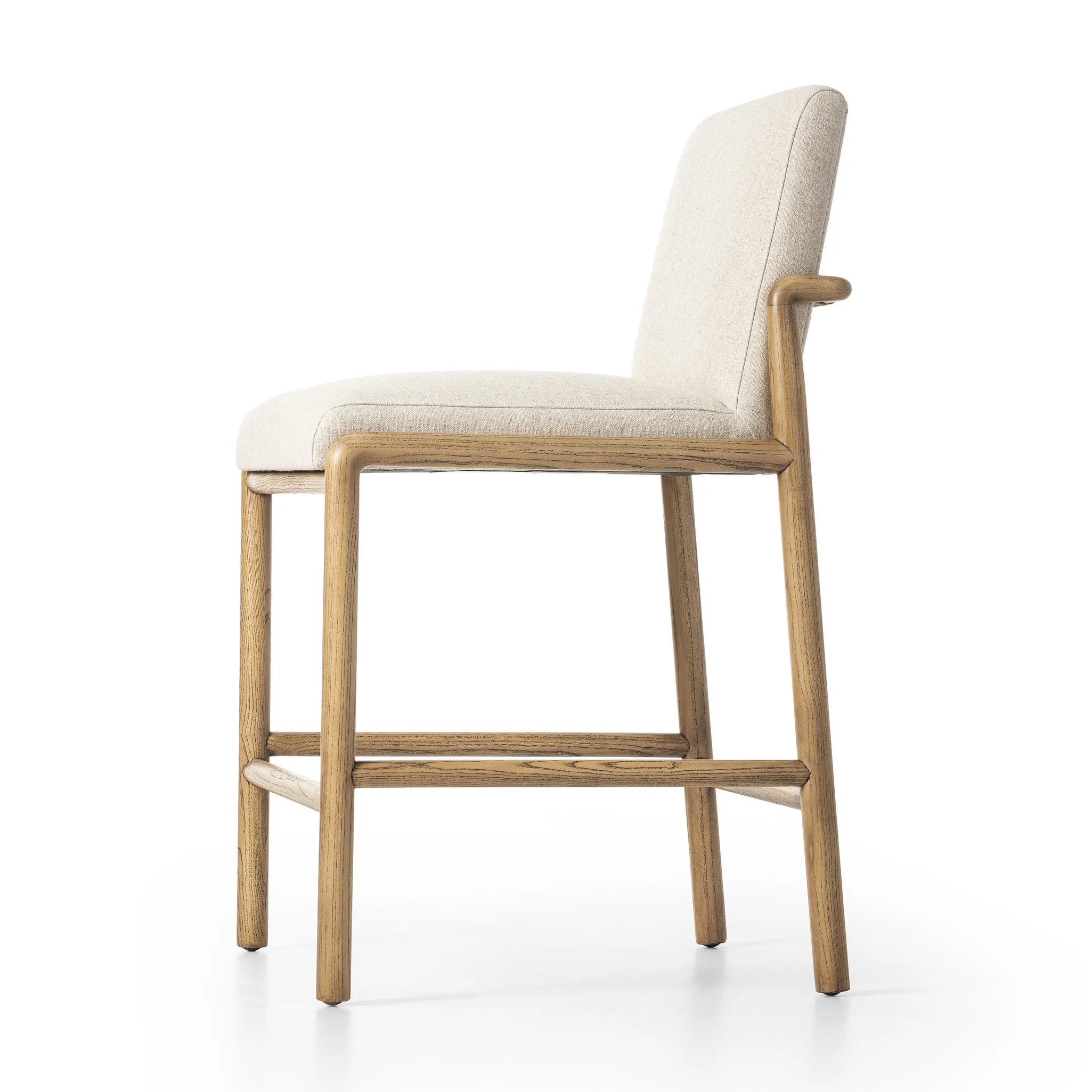 Featuring Taki Antwerp Natural Bar + Counter Stool by Four Hands at Amethyst Home. A fluid nettlewood frame cradles a comfortable cushion in a high-performance linen blend. At the back of the chair, a fabric covered handle adds architectural interest to a seamless form. Perfectly sized for the counter. Performance fabrics are specially created to withstand spil. Amethyst Home provides interior design, new home construction design consulting, vintage area rugs, and lighting in the Miami metro area.