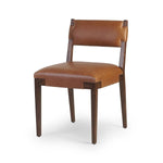 Featuring Tamari Sonoma Chestnut Dining Chair by Four Hands at Amethyst Home. Upgrade your dining experience with the Tamari Sonoma Chestnut Dining Chair. Made with high-quality materials, this chair provides comfortable seating while adding a touch of elegance to your dining room. Its sleek design and sturdy construction make it the perfect addition to any h. Amethyst Home provides interior design, new home construction design consulting, vintage area rugs, and lighting in the Houston metro area.